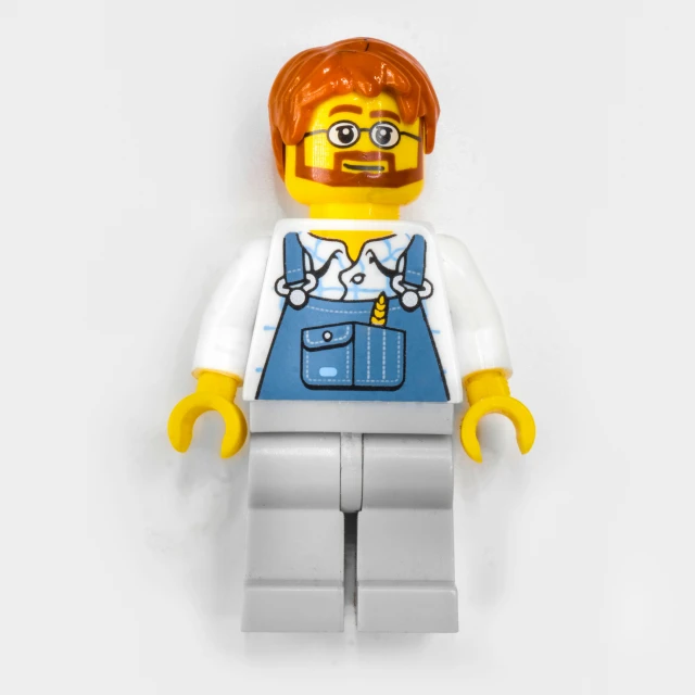 a close up of a lego figure with an orange hair