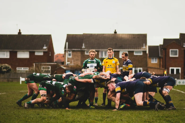 players are huddled up in the middle of a scrumpting game