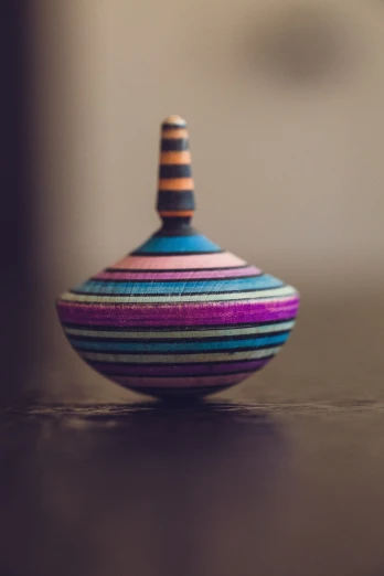 a striped bowl that has been made by hand