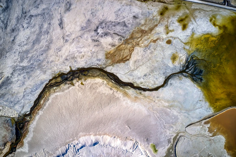 a group of rocks with different colored water inside