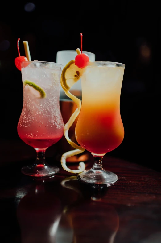 a picture of some cocktails with some fruit