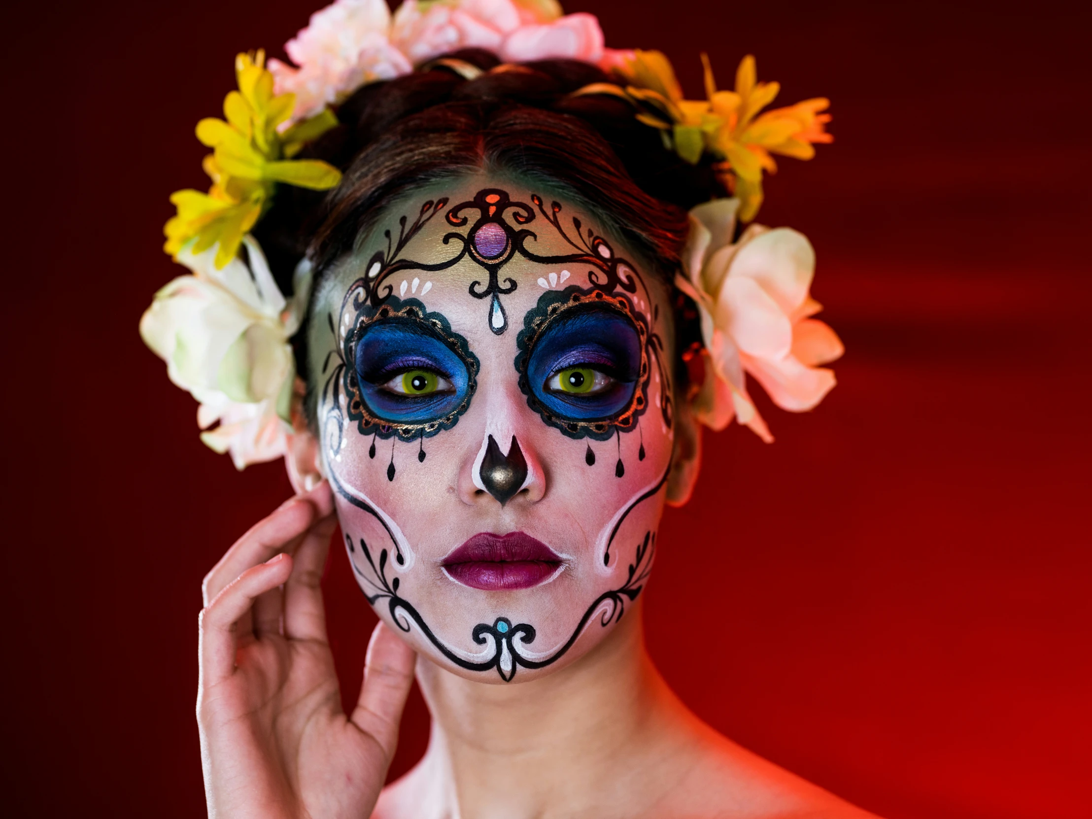 woman with floral wreath painted on face and face