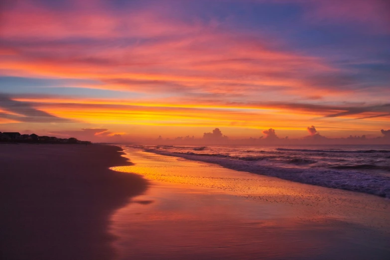 the sunset and the shoreline at beach shore