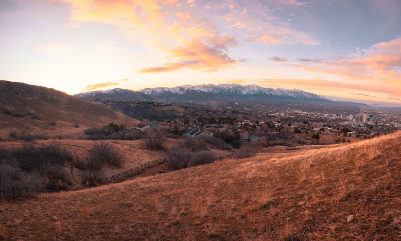 a view of mountains and a valley at dusk