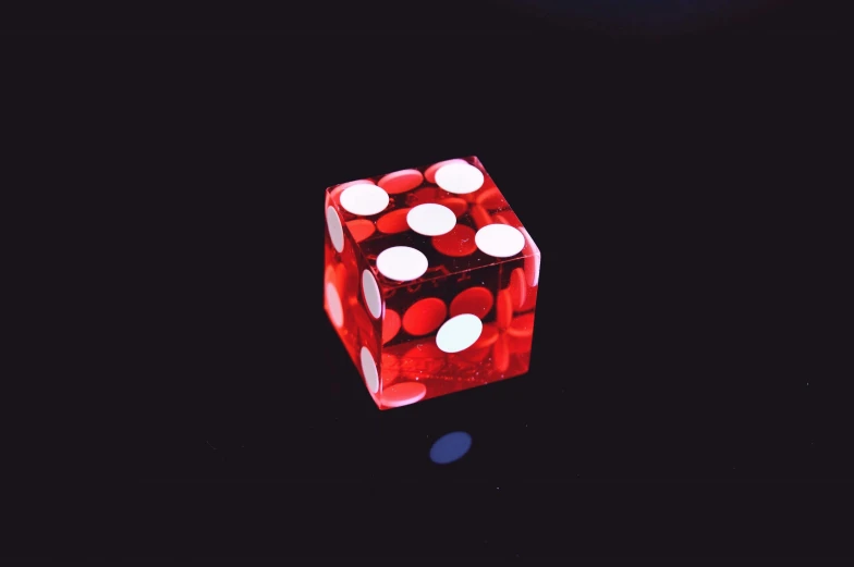 the four sided dice is in red and white