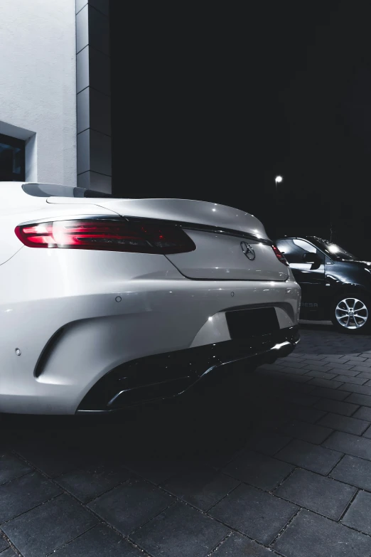 two cars parked side by side on the street