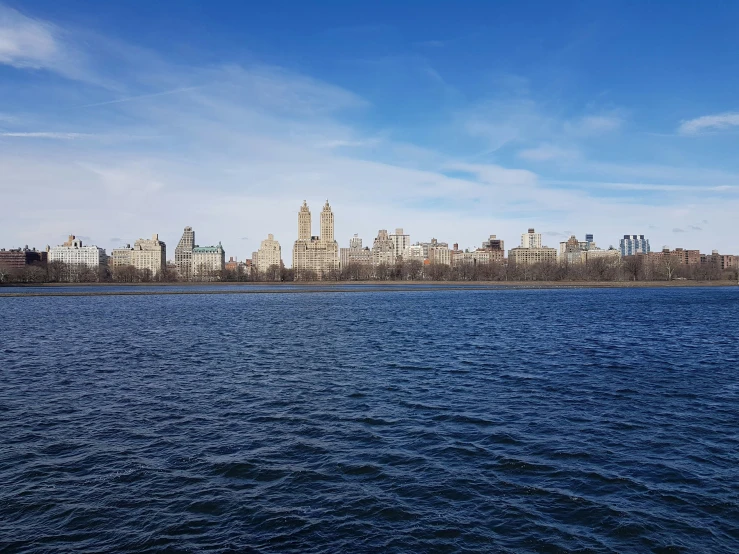 a large body of water sitting in front of a city