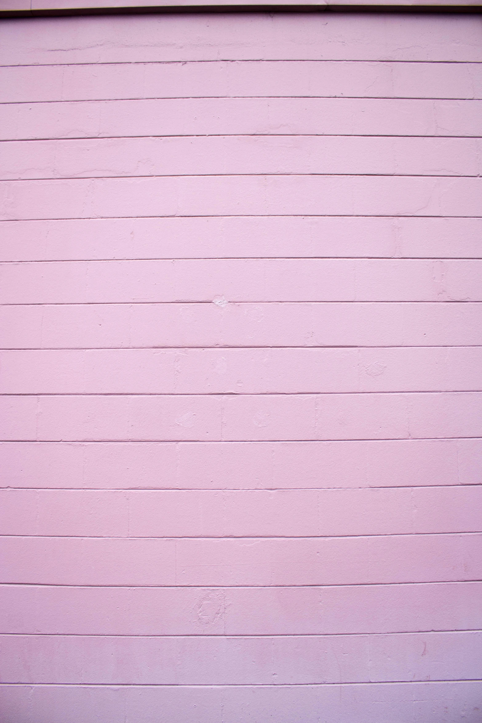 a close - up view of the side of pink paint