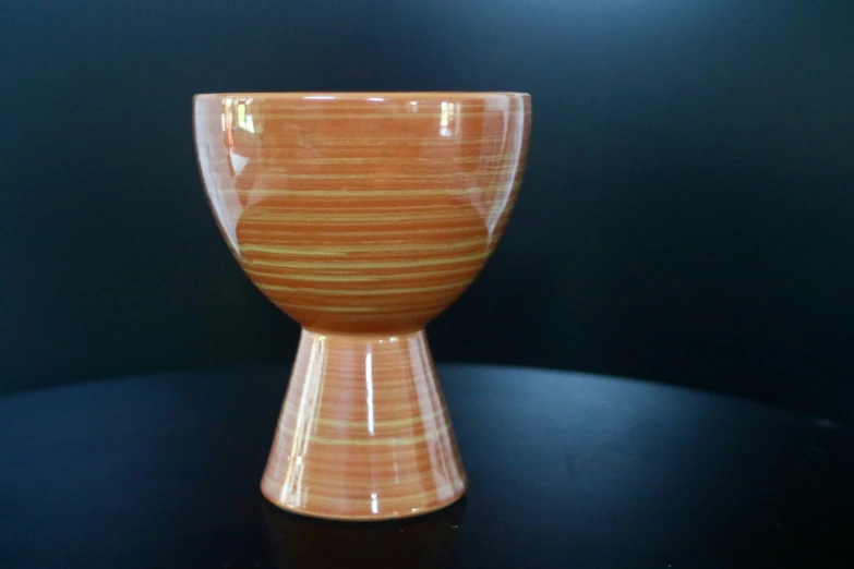 a small vase sitting on a table top