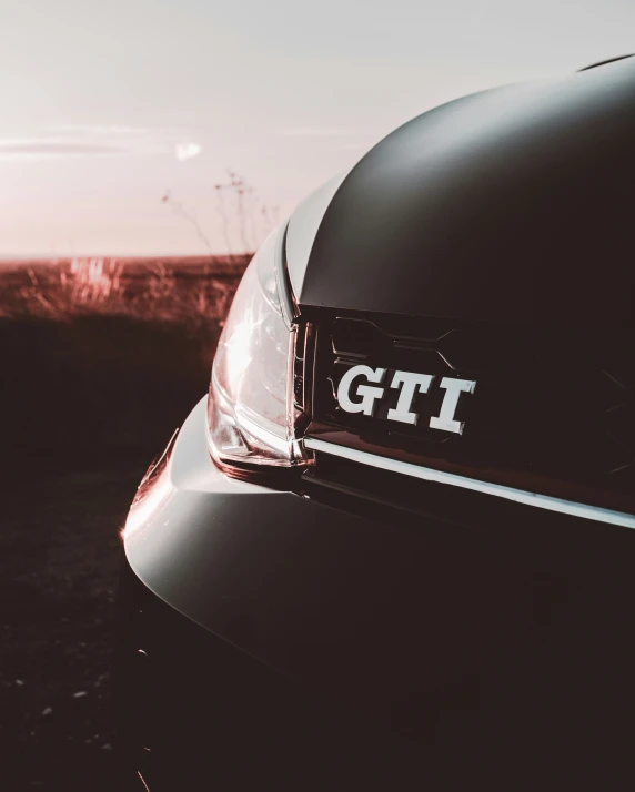 a parked sports car with the letters gti on it