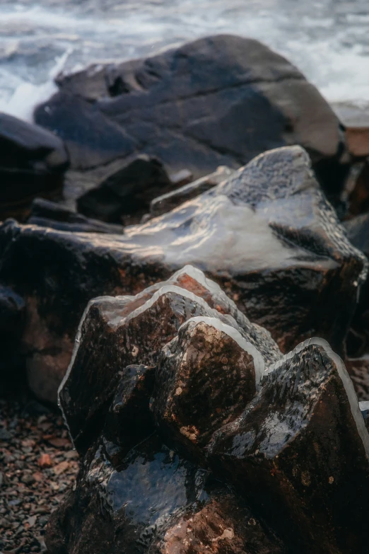 this is a rock on the beach by the water