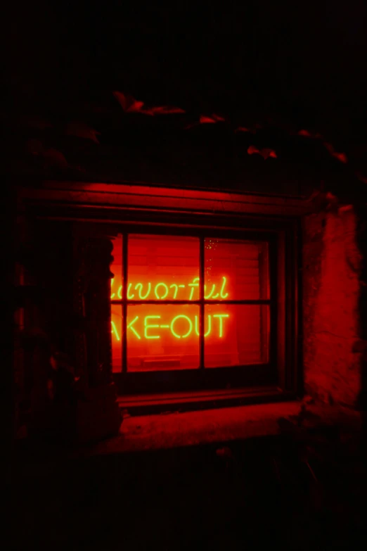 the lighted neon sign in the window says worth to keout