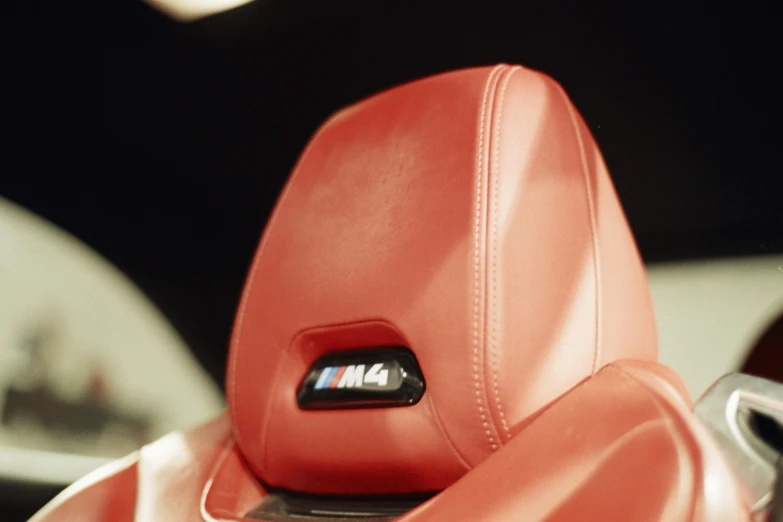 a red sports car with a badge in the center