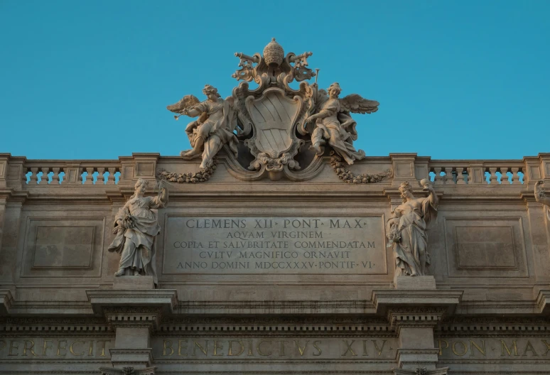 the building has statues on top of it