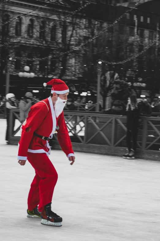 a santa clause skating in an indoor rink