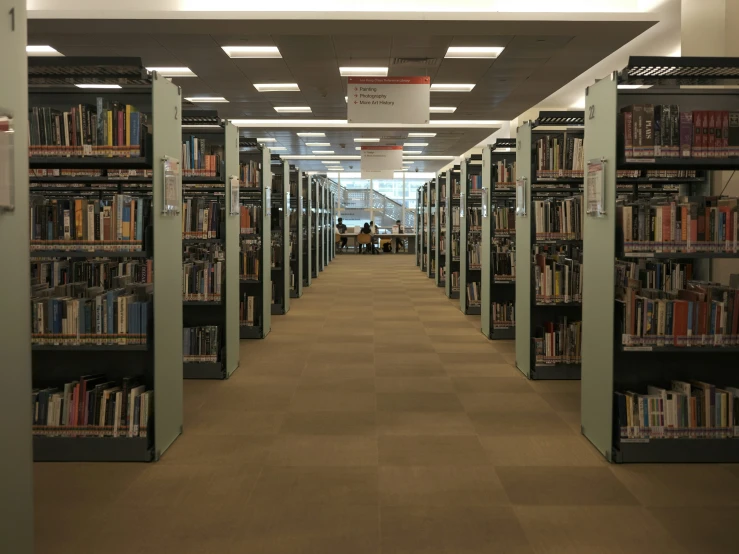 there is a row of books that are on shelves