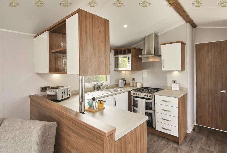 small and neat looking kitchen area with white cabinets