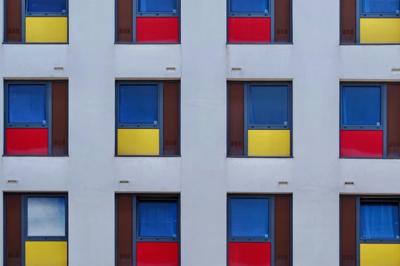 a colorful building facade, with a stop sign in the foreground