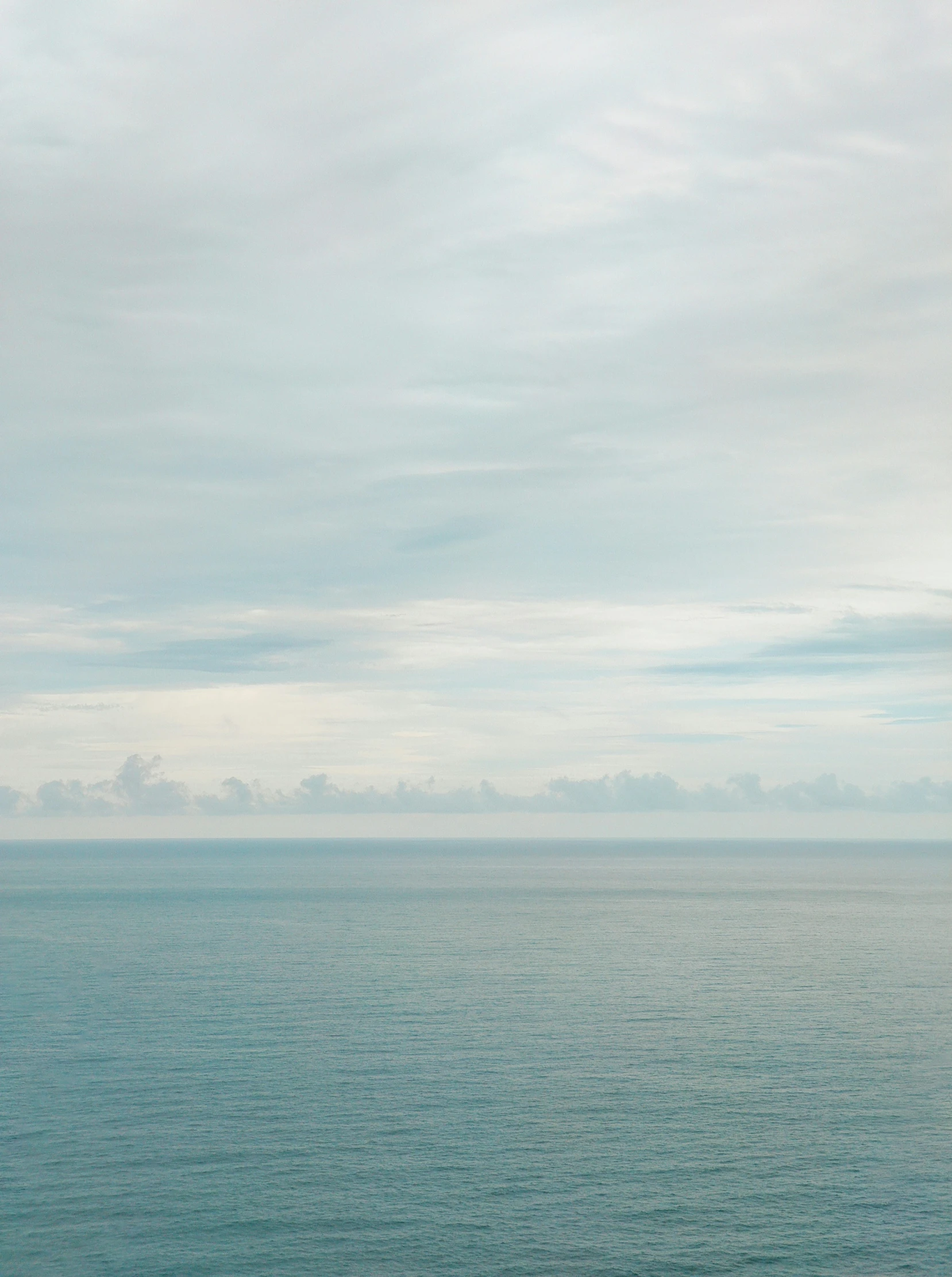 the large body of water is calm as it sits on land