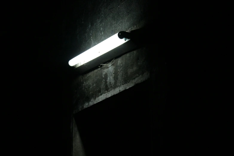 this is a street light lit by the night