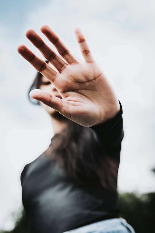 a blurry image of someone's hand with one palm