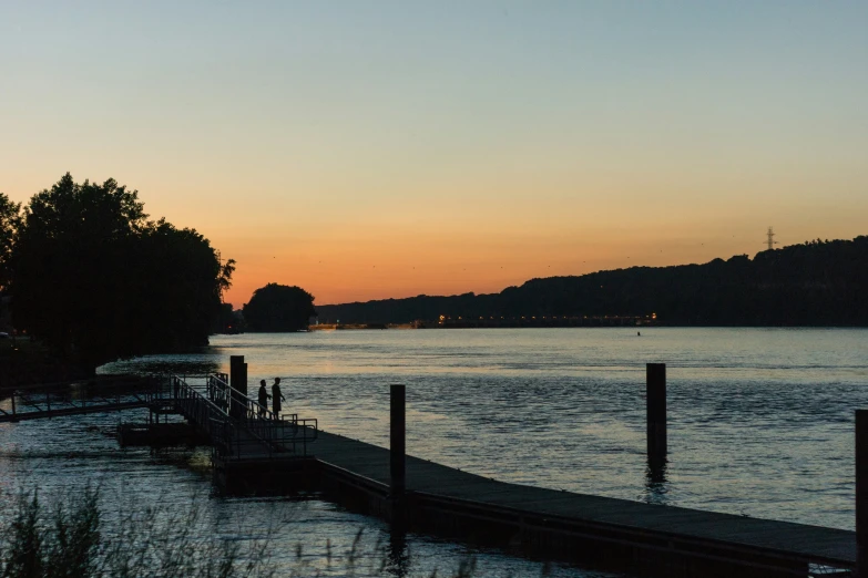 a boat dock sits out on the water