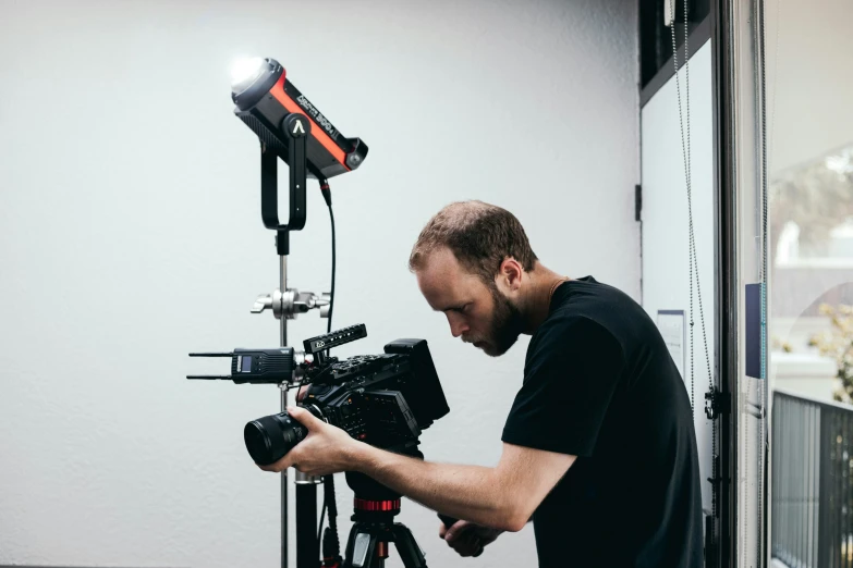 a man holding a camera and taking pictures