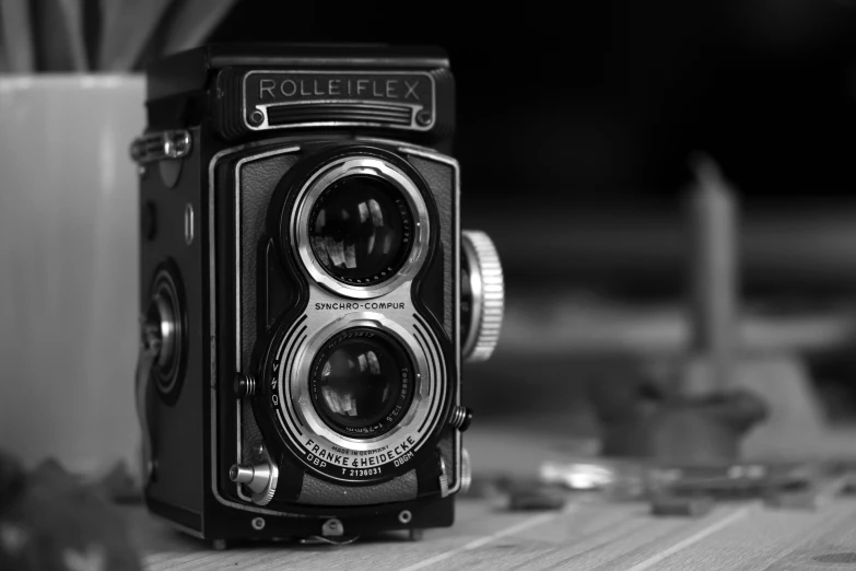 an old style camera sitting on a table