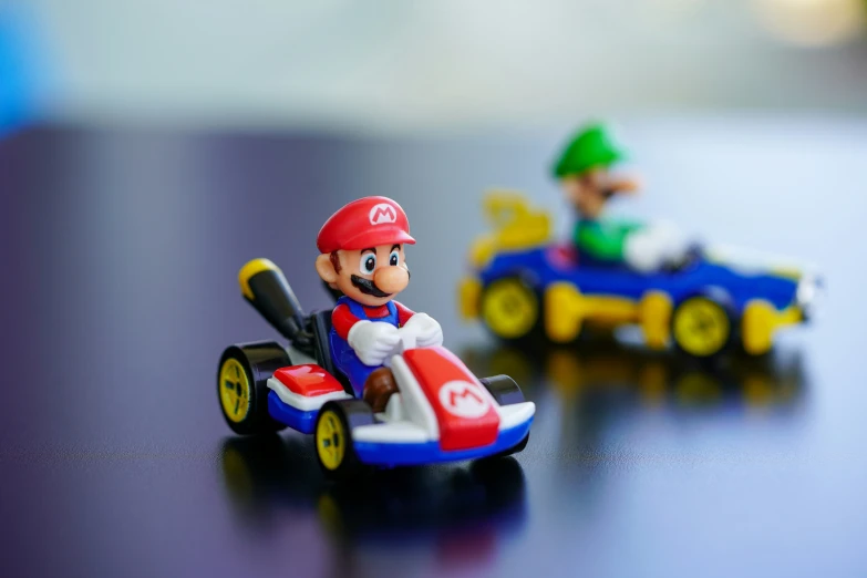 a lego mario kart racing toy and luigi on a track