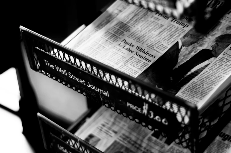 a stack of newspapers stacked on top of each other