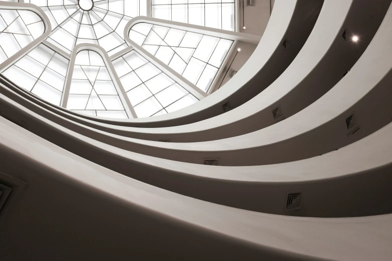 the view from below a glass window in a modern building