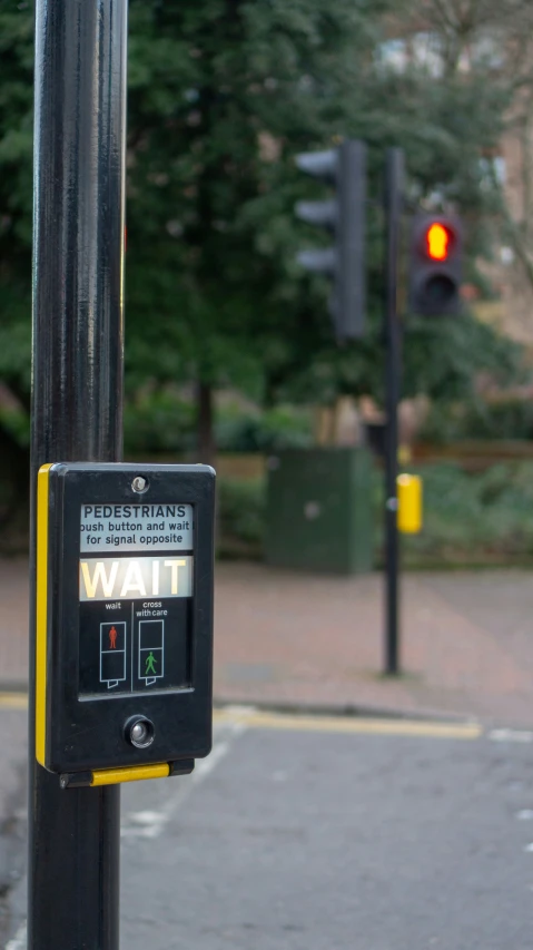 a traffic light hanging on the side of a pole