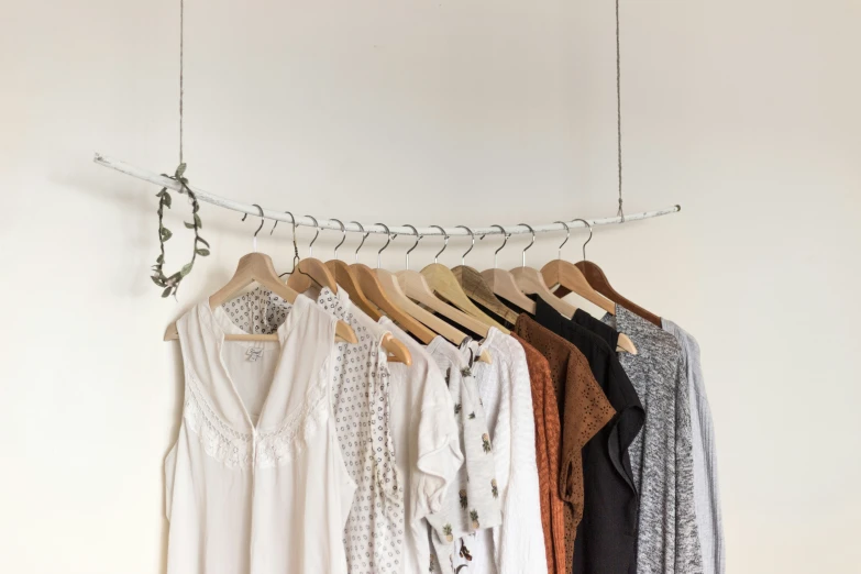a line of clothes hang on a wire