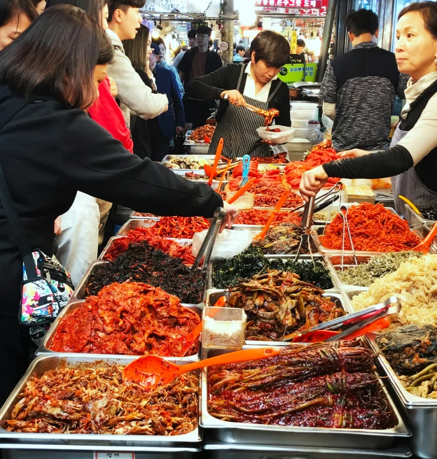 the crowded buffet line of a chinese restaurant