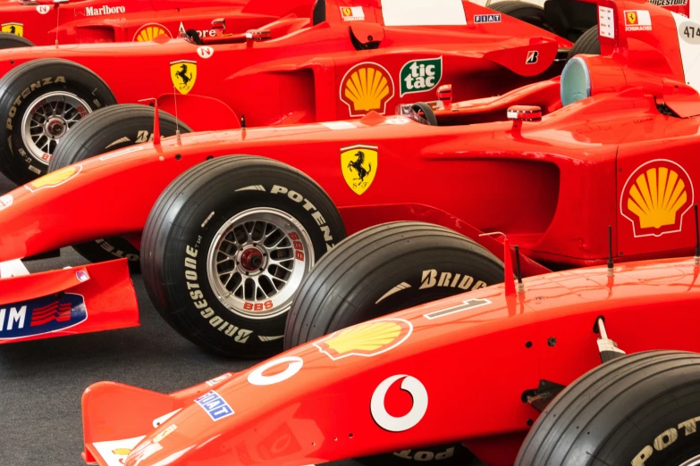 a po of a row of ferrari cars in a line