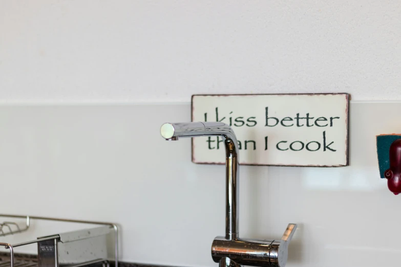 a sink that has a toothbrush and some toothpaste in it