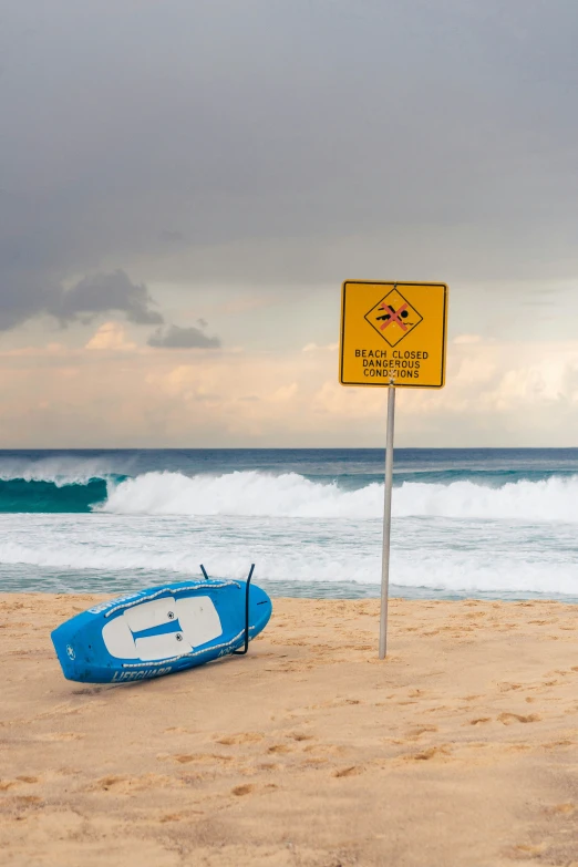 a surf board is lying on the beach