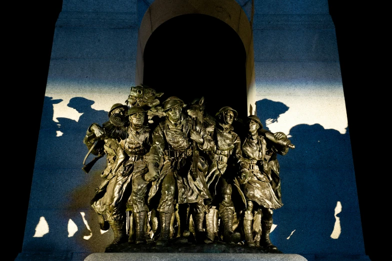 a picture of a monument with people and shadows cast on it