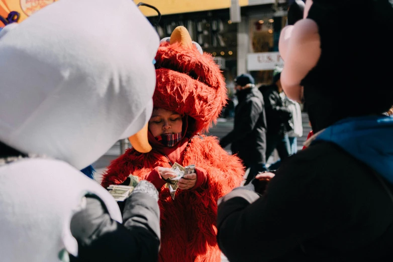 people in costumes are standing on the street