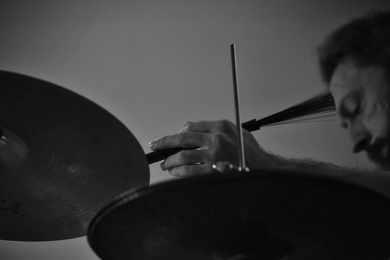 a drummer playing drums on stage with his instrument