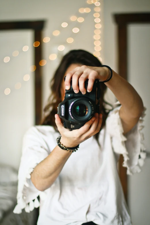 a woman taking a pograph with her camera