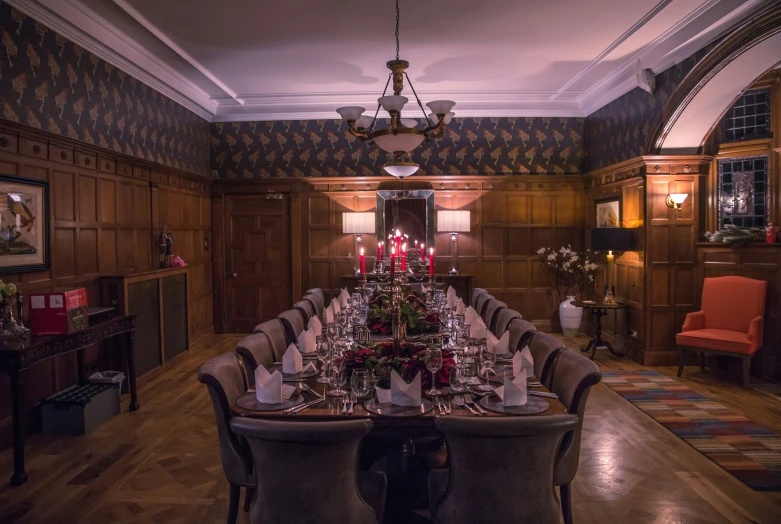 a long table sits with candles on top