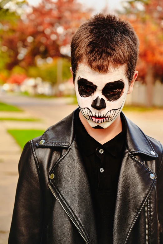 a man is wearing a black and white skeleton make - up
