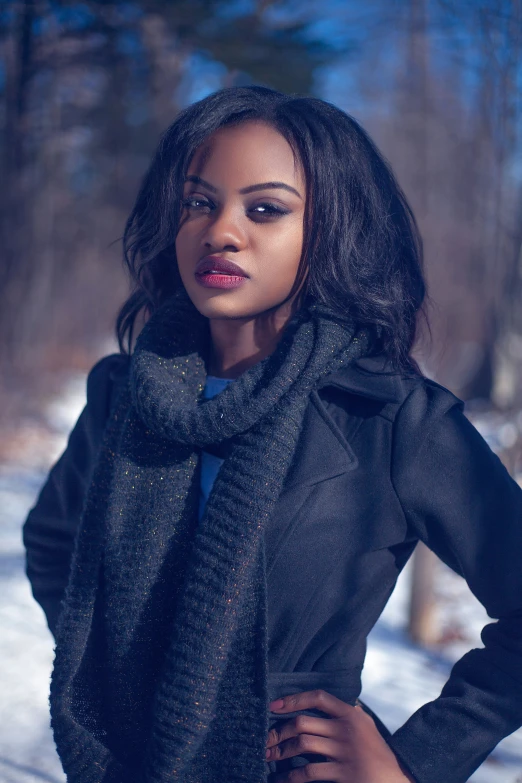 a young woman wearing black clothes posing for the camera