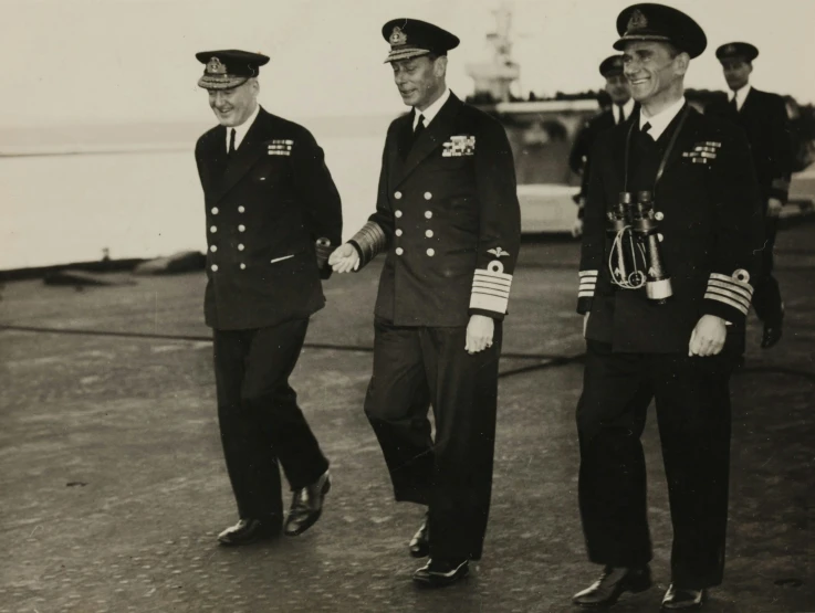 three people walking next to each other near an aircraft