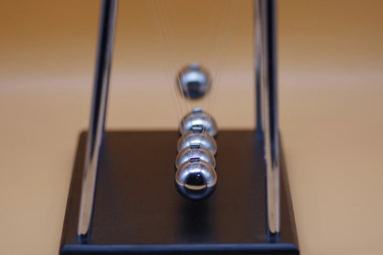 a close up of a glass object with beads inside