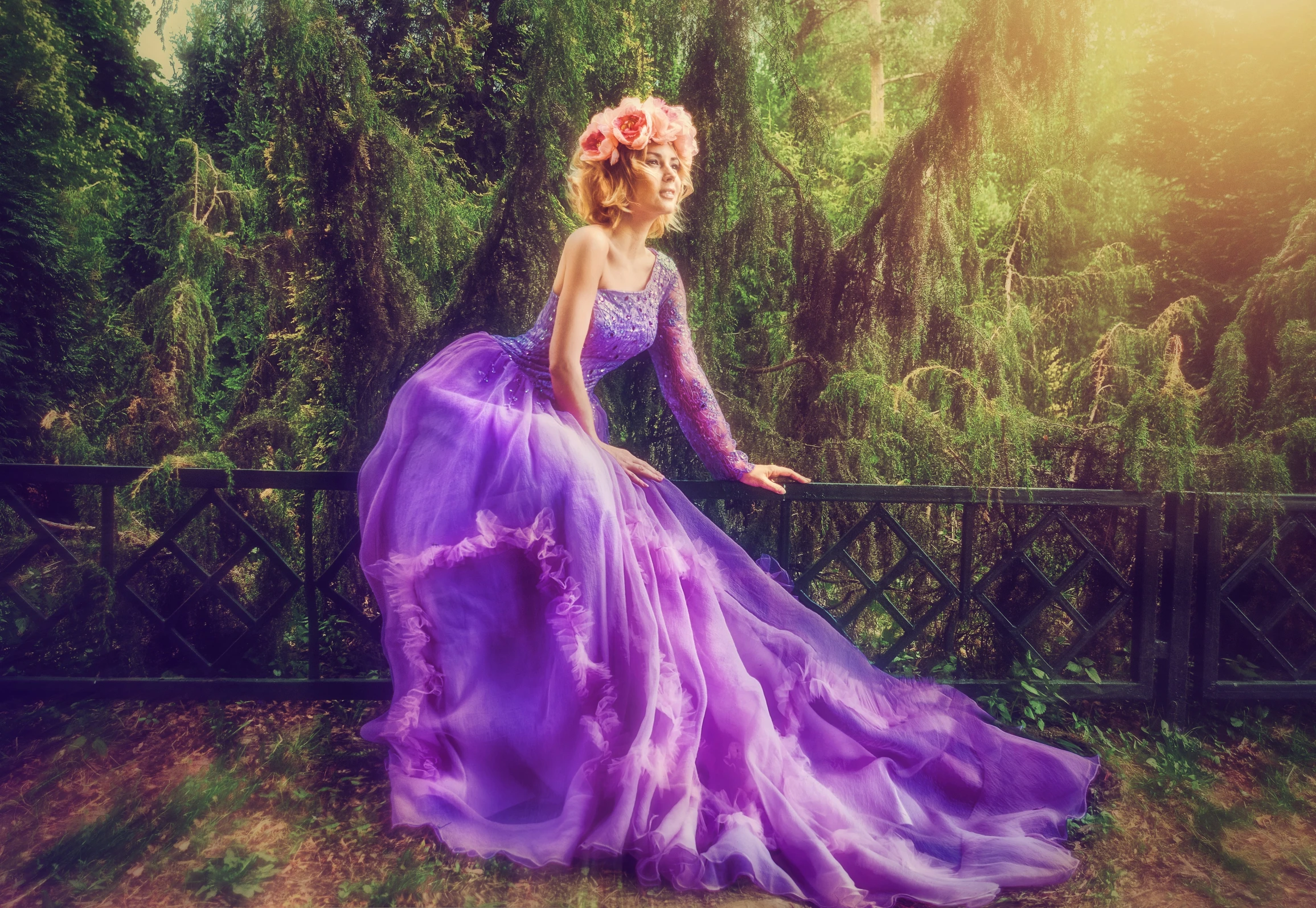 woman in purple evening gown by some trees