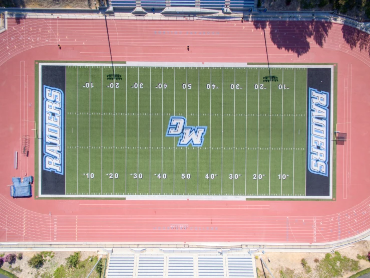 an aerial s of a football field in college football stadium