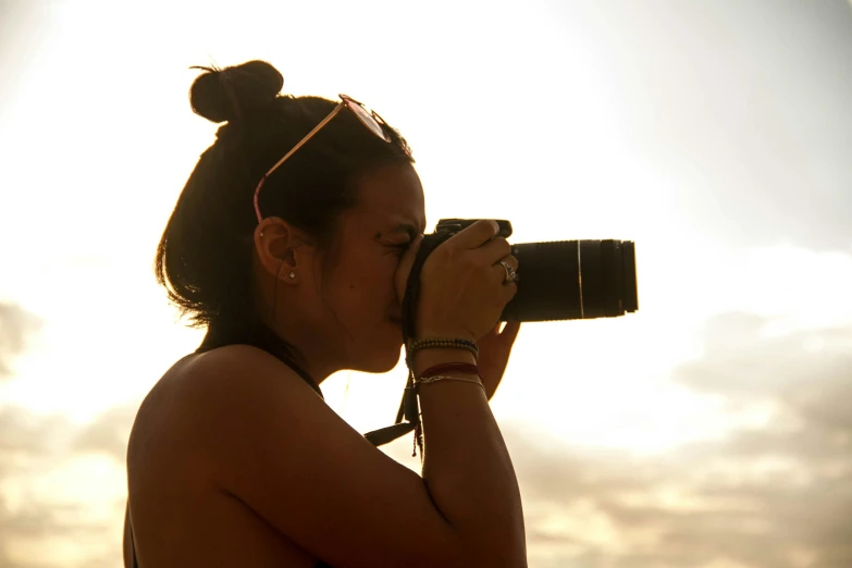 a person in a bikini with a camera