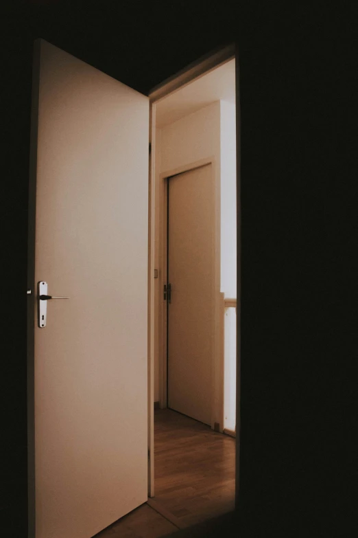 a large white door opened to a room